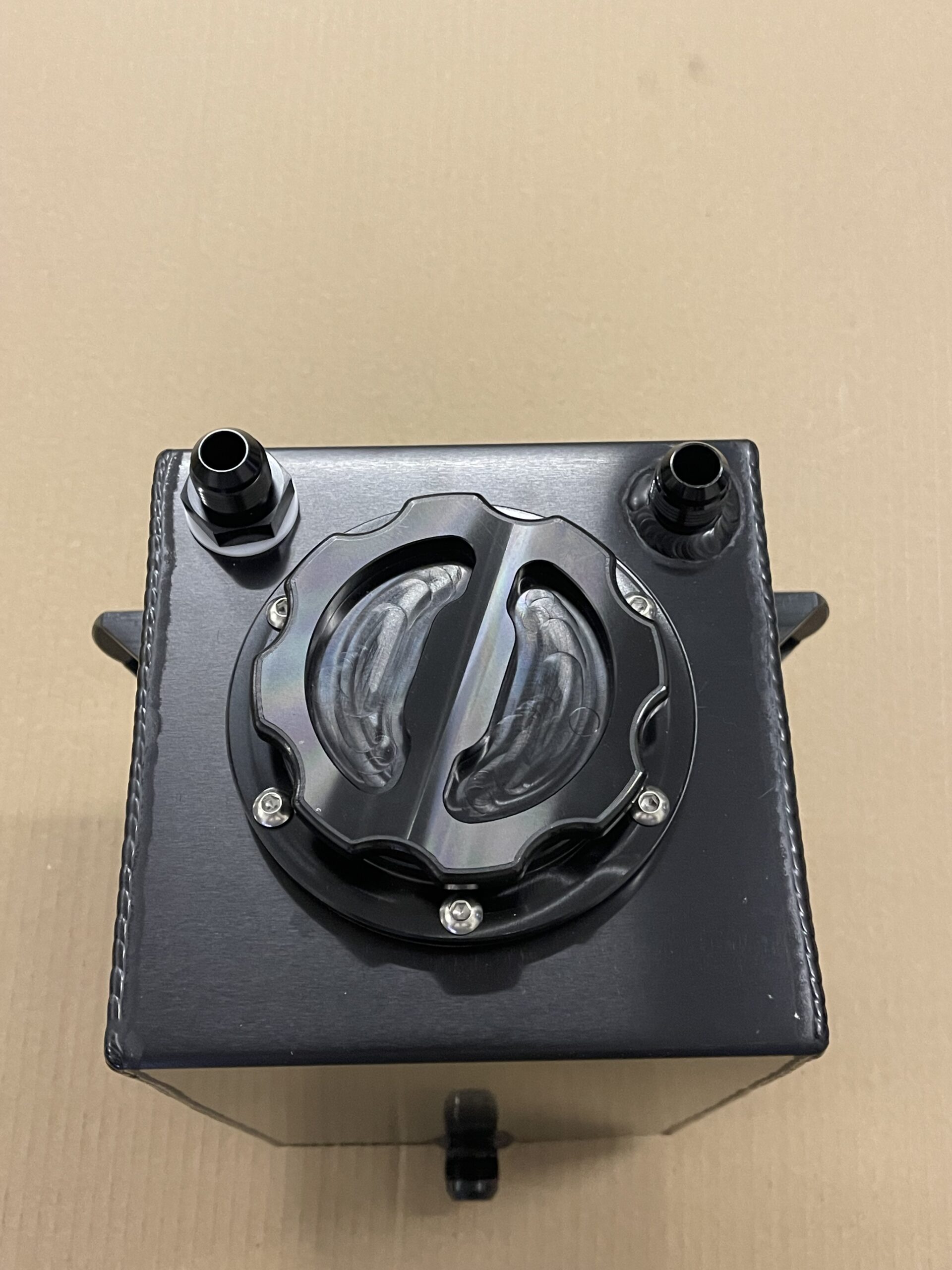 2.5 gallon race car fuel cell, anodized black. 12an outlet in sump